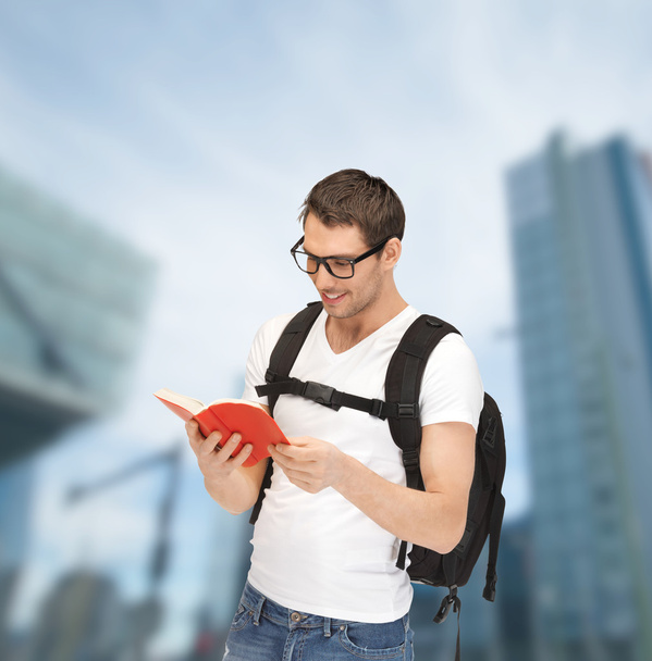Student in eyeglasses with backpack and book - Foto, Imagem