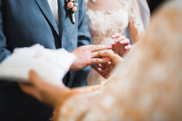 Wedding rings on ceremony at church. Macro. - Fotó, kép