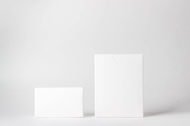 Two white boxes on a white background. On the boxes there is a place for inscriptions and logos - Photo, image