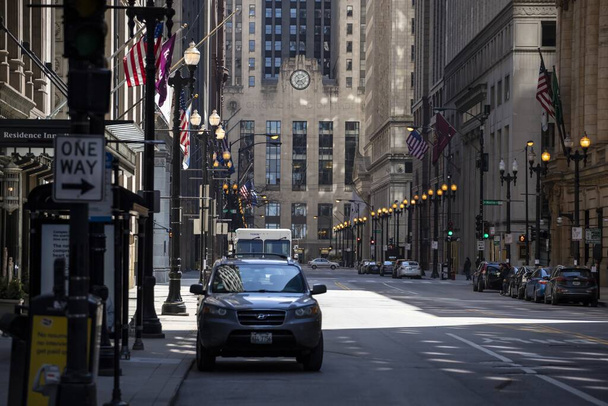 CHICAGO, UNITED STATES - Apr 18, 2020: The streets of Chicago downtown are isolated and empty due to the corona virus pandemic Covid-19. Business are shutdown - Photo, image