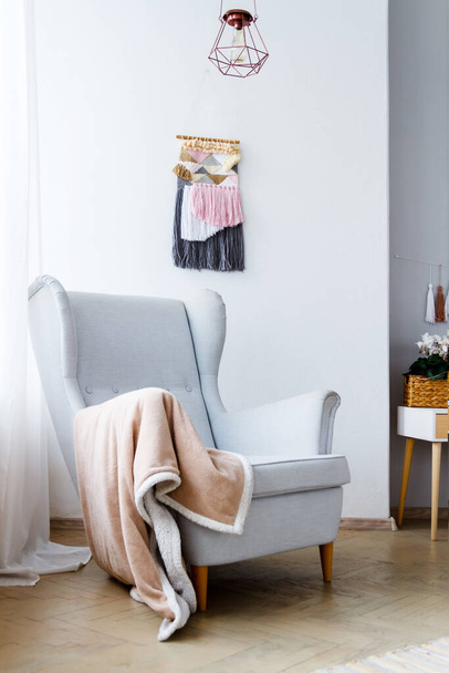 Stylish armchair in a bright cozy living room - Valokuva, kuva