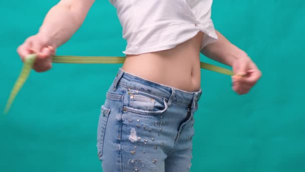 Woman measuring her waistline. Perfect Slim Body. You can get the same results - Footage, Video