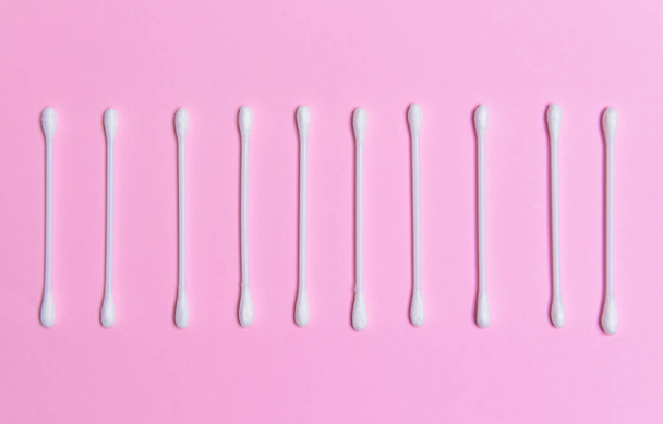 Cotton cosmetic swabs on color background - Photo, Image
