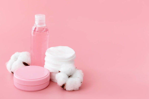 Cosmetics with cotton pads on color background - Photo, Image