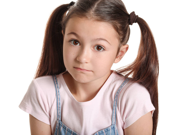 Apologizing little girl on white background - Valokuva, kuva