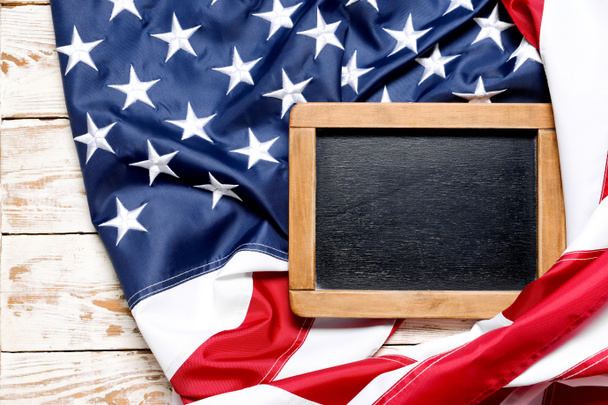 Chalkboard and USA flag on wooden background - Photo, Image