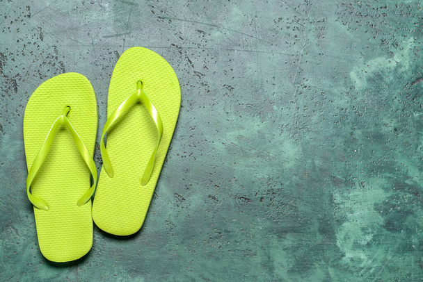 Stylish flip-flops on color background - Фото, изображение