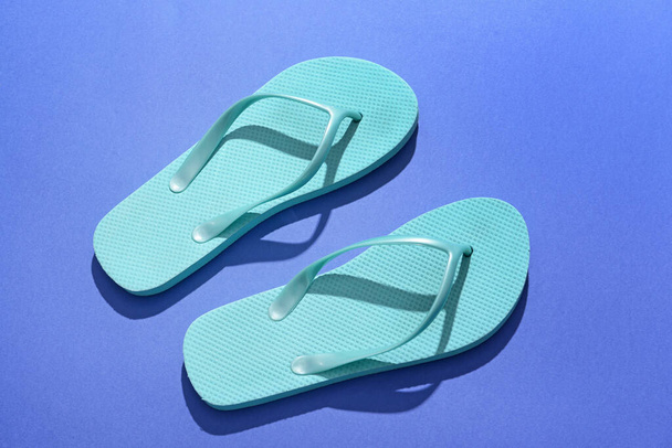Stylish flip-flops on color background - Photo, Image