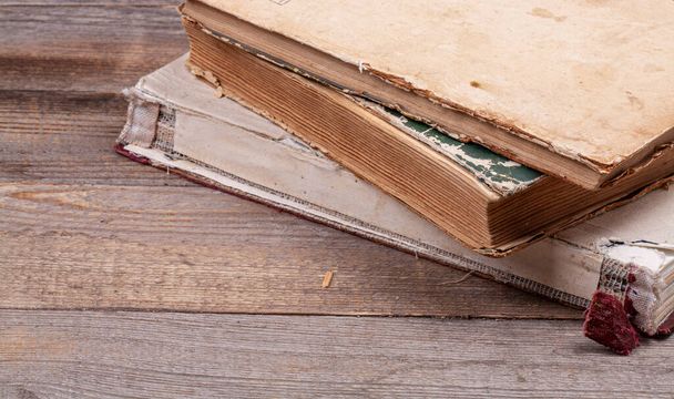 Very old vintage book on a dark wooden background. - Photo, Image