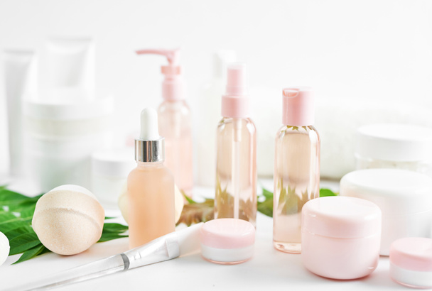 Flat lay composition Natural cosmetics ingredients for skincare, body and hair care.Top view bottles with facial treatment product white background. Makeup Layout. Set of traditional spa products - Photo, Image