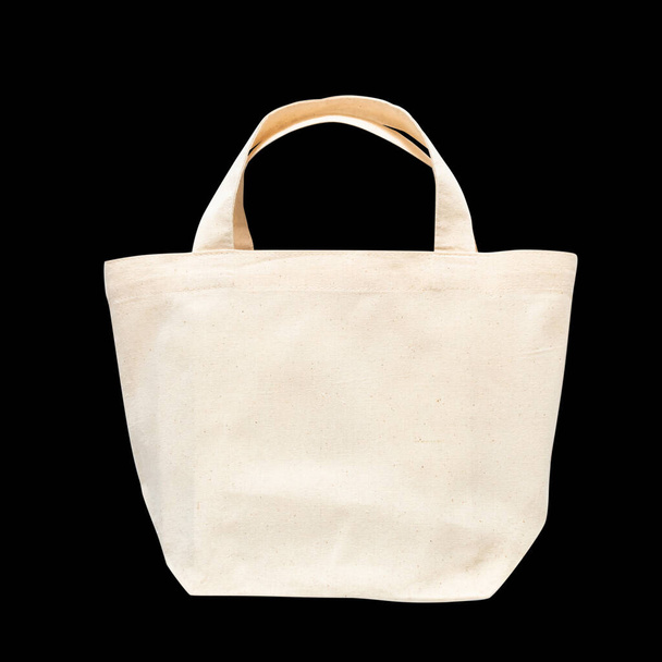 Bolso de mano tela de tela de algodón blanco para hombro eco shopping saco maqueta en blanco plantilla aislada sobre fondo negro (camino de recorte
) - Foto, imagen