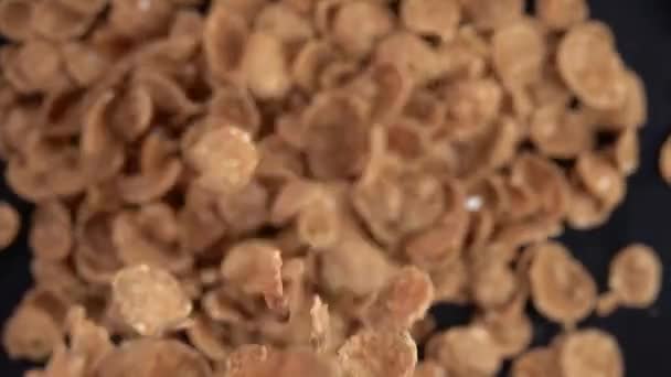 Wheat flakes falling on black. Slow motion 250 fps - Footage, Video