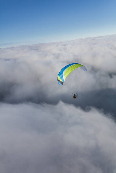 aerial view of the paraglider over the clouds - Photo, image