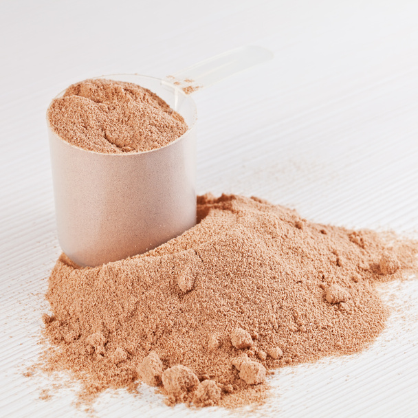 Scoop of chocolate whey isolate protein powder or weight loss po - Photo, Image