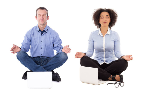 business man and business woman sitting in yoga pose with laptops isolated on white background - Photo, Image