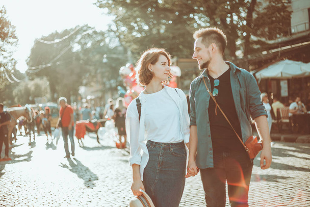 Romantic youth concept. Young stylish hipster couple in love at the city. - Photo, Image
