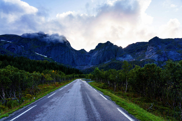 Scenic asphalt road through the beautiful view of mountain in Lofoten island, Norway during autumn. Concept of roadtrip, travel, vacation, adventure - Fotoğraf, Görsel