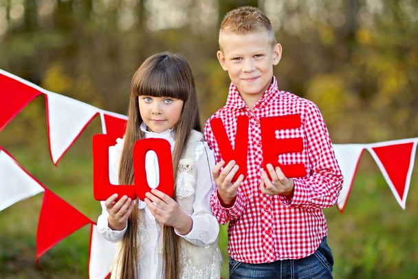 portrait of little boy and girl with decor style Valentine's Day - Foto, Imagem
