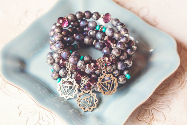 Mineral stone crystal quartz beads metal pendant bunch of bracelets  - Photo, Image