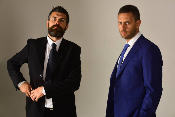 Businessmen wear smart suits and ties. Leaders settle disputes - Fotografie, Obrázek