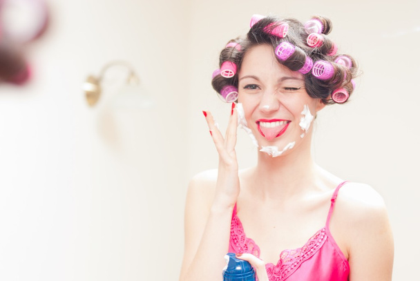 Girl shaving with foam & razor her face - Fotografie, Obrázek