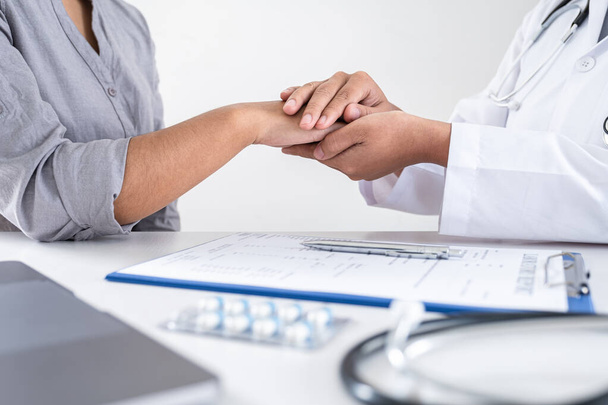 Image of doctor holding patient's hand to encourage, talking with patient cheering and support, healthcare and medical assistant. - Фото, зображення