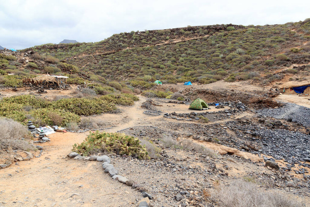 Tents at beach Playa de los Morteros on Canary Island Tenerife, Spain - Photo, Image