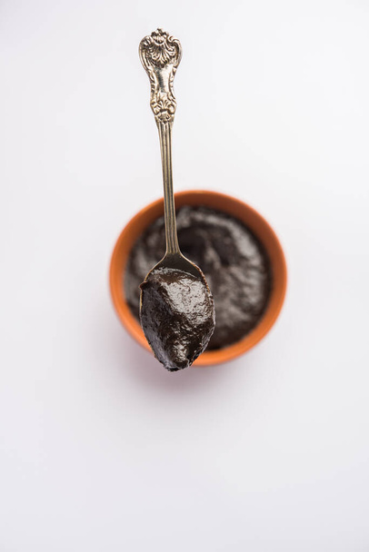 Chyawanprash or Chyavanprash is an Indian Ayurvedic Immunity booster health supplement made up of a concentrated blend of minerals and nutrient-rich herbs, served in a bowl, isolated - Fotó, kép