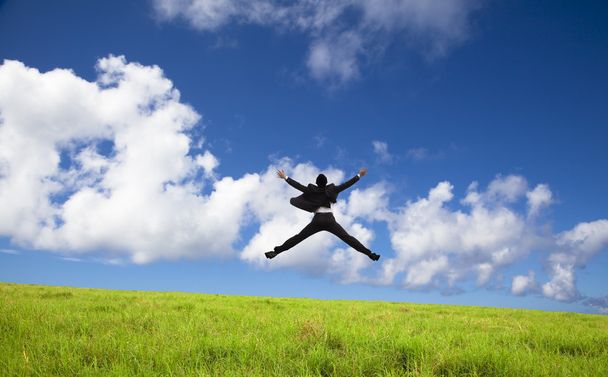 Happy and successful Businessman jumping - Photo, Image