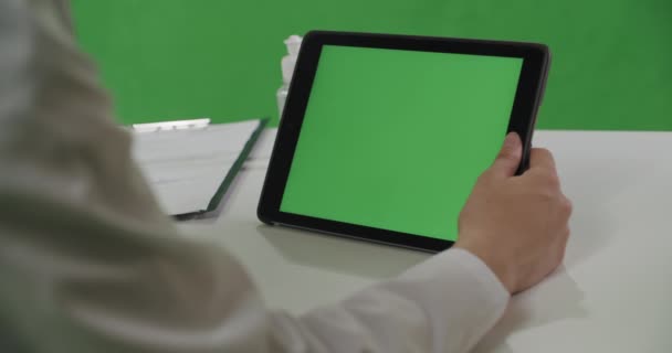 Medical worker woman in white coat uses tablet - Felvétel, videó