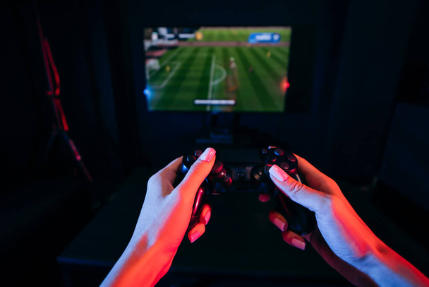 Close up female hands holding gamepad and playing videogames - Photo, Image