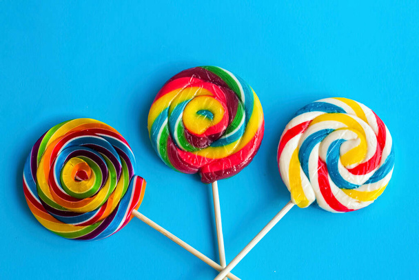Colorful lollipops and different colored round candy. Top view. - Photo, Image
