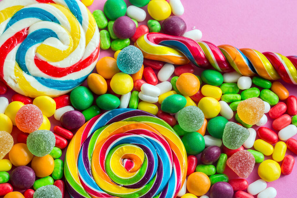 Colorful lollipops and different colored round candy. Top view. - Φωτογραφία, εικόνα