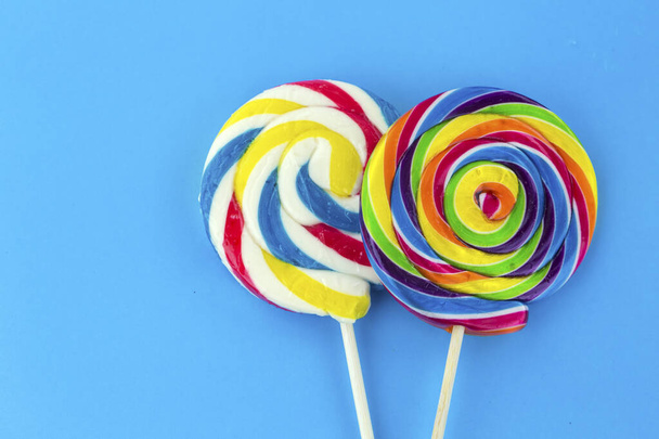 Colorful lollipops and different colored round candy. Top view. - Fotografie, Obrázek