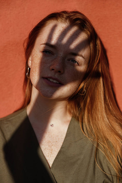 portrait of a girl with a shadow on her face - Zdjęcie, obraz