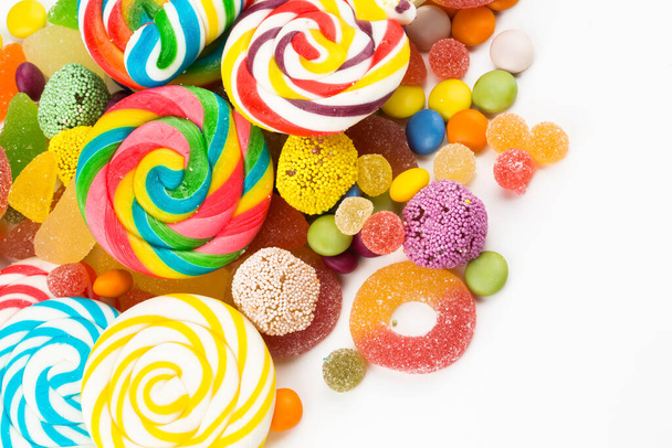 Colorful lollipops and different colored round candy. Top view. - Photo, Image