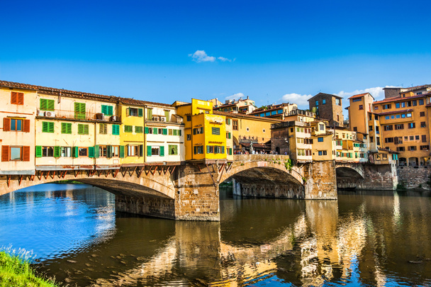 Famous Ponte Vecchio with river Arno at sunset in Florence, Italy - Photo, Image