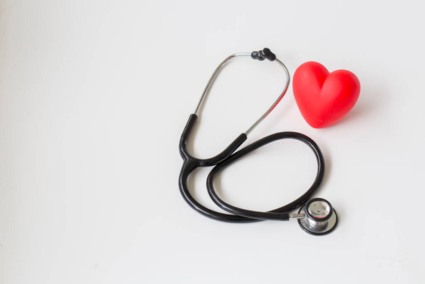 Stethoscope and red heart. Heart Check. Concept healthcare. - Valokuva, kuva