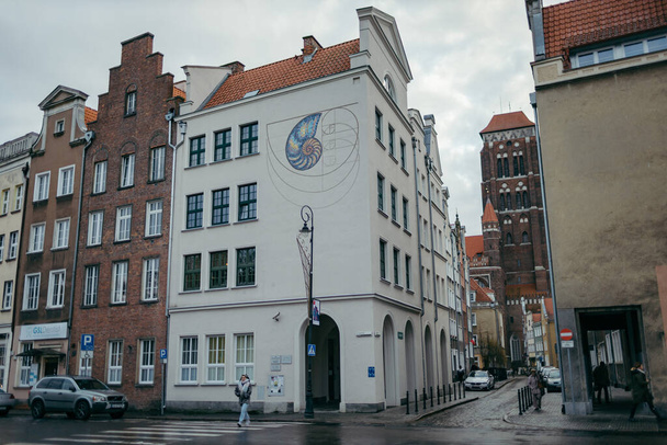 A city street in front of a building - Fotó, kép
