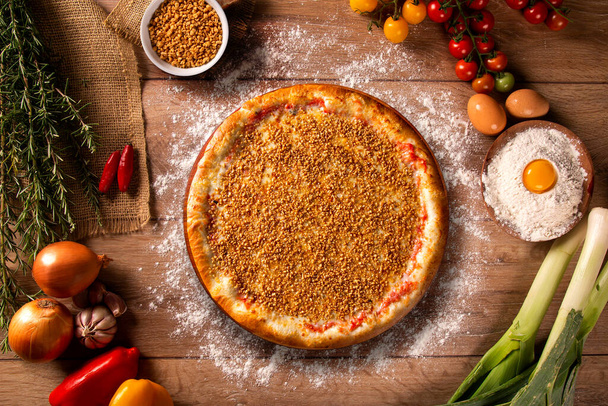 Garlic Pizza. Top view on wood background, close up. Traditional Brazilian Pizza. - Photo, Image