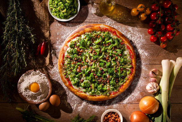 Pizza Broccoli and bacon on wood background. Top view, close up. Traditional Brazilian Pizza. - Photo, image