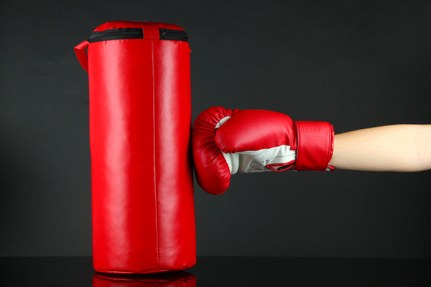 Box training and punching bag, isolated on black - 写真・画像