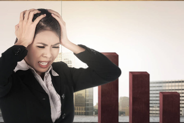Asian businesswoman feeling depressed with global economic impact because coronavirus pandemic - Photo, image