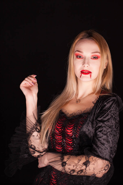 Woman with vampire red dress for halloween - Foto, Bild