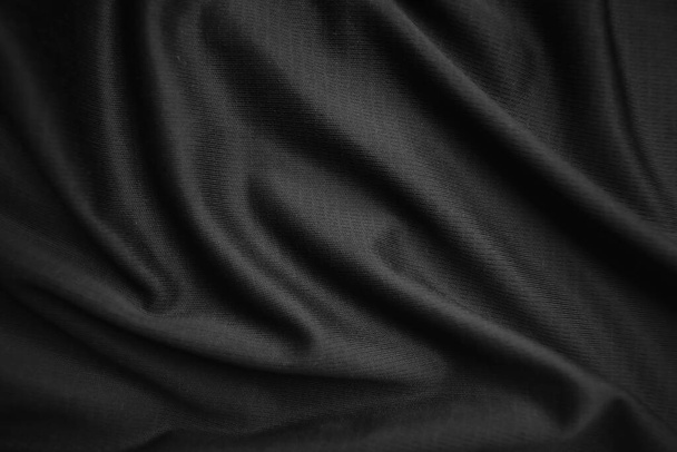 Achtergrondtextuur zwarte doek. Abstracte donkere golvende zacht. De stof is gerimpeld. Fashion luxe stijl. - Foto, afbeelding