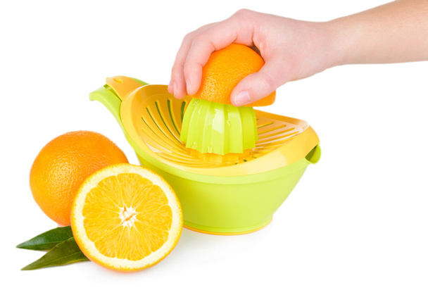 Preparing fresh orange juice squeezed with hand juicer isolated on white - Fotoğraf, Görsel