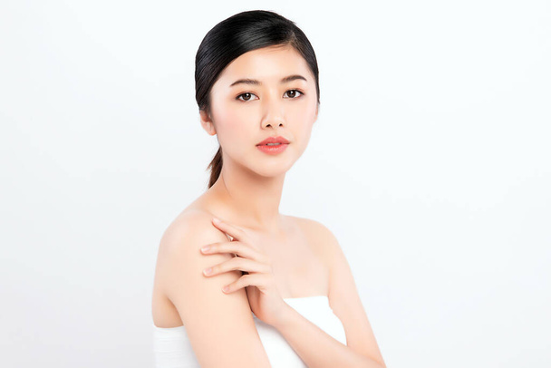 Beautiful Young Asian Woman touching her body with fresh Healthy Skin, isolated on white background, Beauty Cosmetics and Facial treatment Concept - Photo, Image