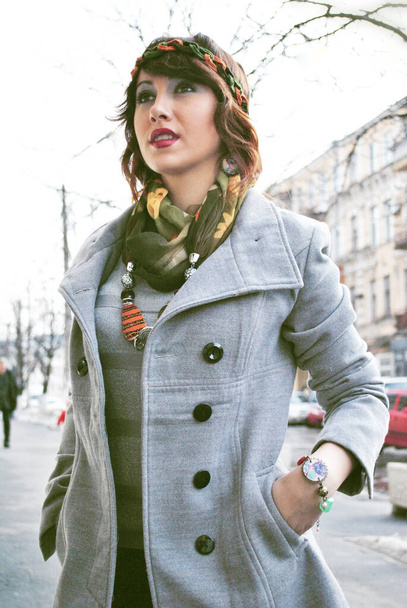 Stylish young woman at city. Autumn fashionable style, girl in coat at city, portrait of modern lady - Photo, Image