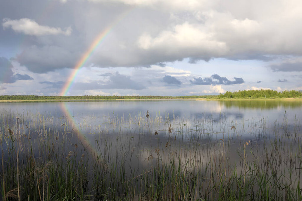 View of rainbow over Seliger lake in summer, Russia - Photo, Image