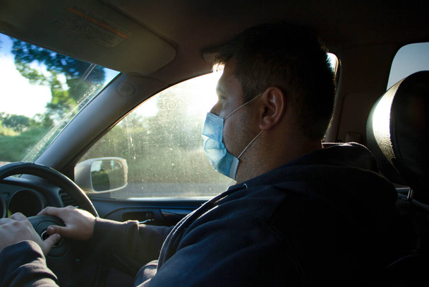 Man driving a medical mask - Photo, Image